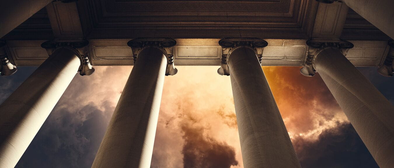 Building columns on a government building on a stormy afternoon.